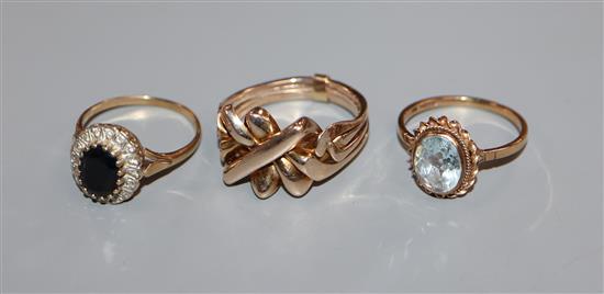 Two 9ct gold gem set rings and one other yellow metal ring.